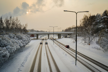 Traffic on icy and slippery road in winter in cold weather