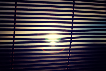 sun shining through the blinds