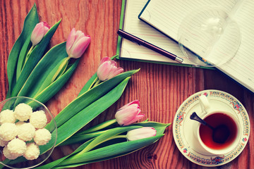 background wooden with tulip and tea