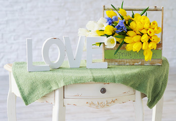 .Interior decoration elements with vintage table, love letters and spring flowers bouquet.