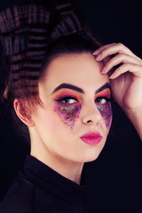 Fototapeta na wymiar Cute Woman with Colorful Makeup. Creative Makeup and Hairstyle