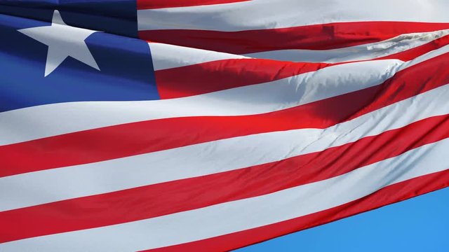 Liberia flag waving in slow motion against clean blue sky, seamlessly looped, close up, isolated on alpha channel with black and white luminance matte, perfect for film, news, digital composition