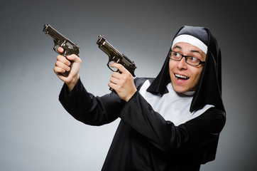 Man dressed as nun with handgun