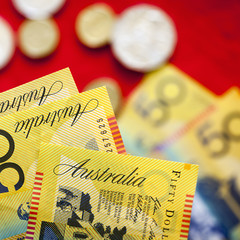 Australian Money over Red Background