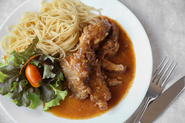 homemade slow cooked spared rib with spaghetti and salad