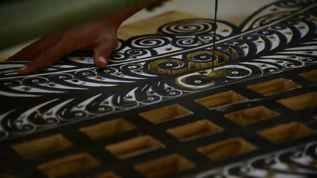 Woodcarving basic shapes to wooden board for later finishing the carvings by hand