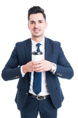 Attractive young manager or banker holding a cup of coffee