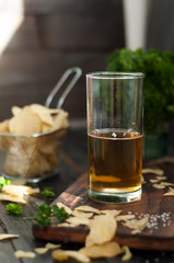 Mug of beer on wooden background