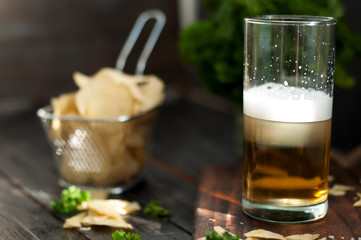 Mug of beer on wooden background