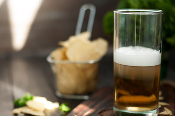 Mug of beer on wooden background