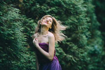 bright woman feels pleasure in nature