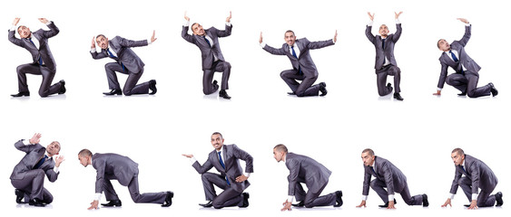 Businessman in various poses isolated on white