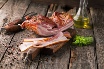 Delicious smoked bacon with spices - 110850555