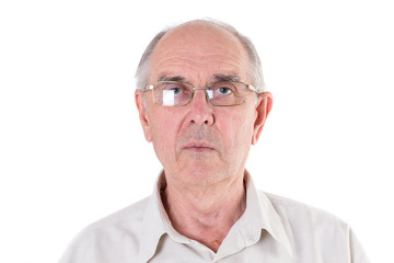 Old man in glasses looking in camera.