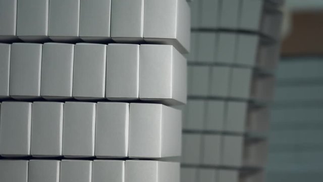 Stack of plain white boxes. Lots of white paper boxes. Warehouse of a big company. Cheap transborder shipping.