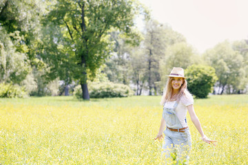 woman on the meadow with yellow flowers