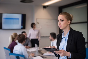 business woman working on tablet at meeting room