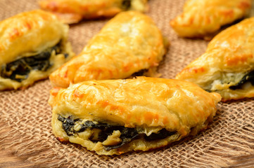 Puff pastries with spinach and cheese.