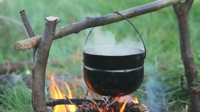 Cooking on a campfire in the mountains