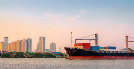 Fototapeta premium Cargo ship was sailing from the river toward the Gulf of Thailand in the evening.
