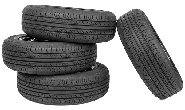 Stack of four wheel new black tyres