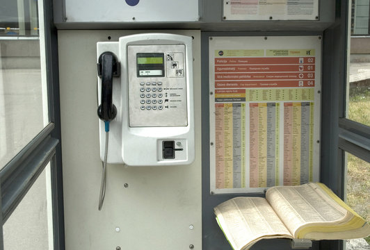 Pay phone with phone and the book