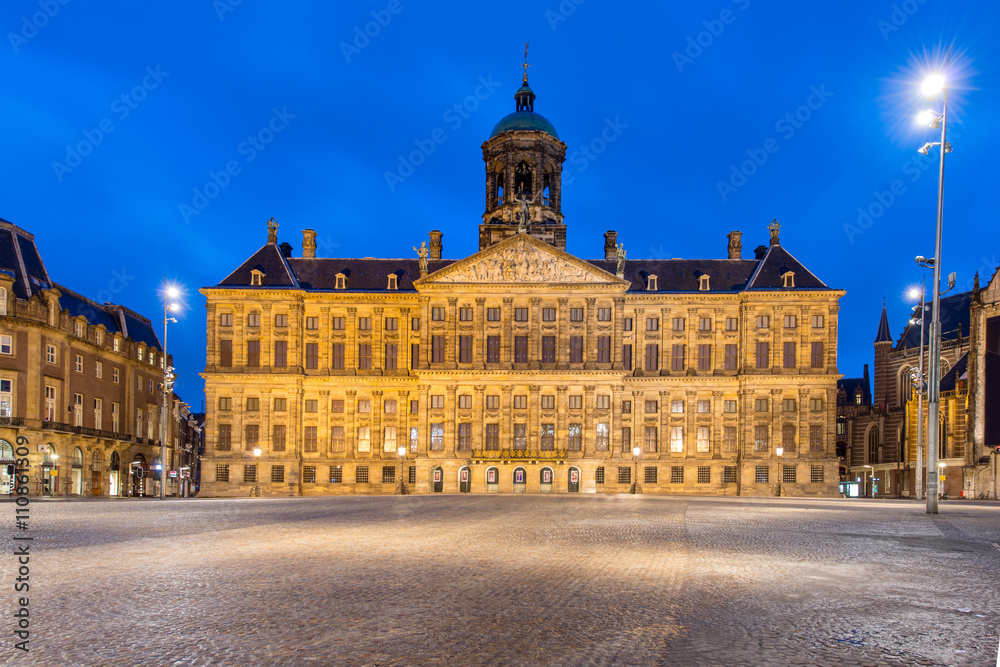 Wall mural Royal Palace in Amsterdam on the Dam Square in the evening. Neth