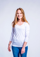 Obraz premium Girl in jeans and t-shirt, young woman, studio shot