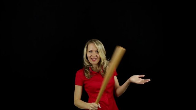 Girl with a baseball bat. Business lady. Business manager. Role-playing games. Woman dominates. Strong independent woman. Black background. 