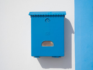 Blue mailbox on the wall