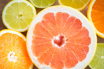 Top view of various citrus fruits. Grapefruits, oranges, limes, lemons. Macro shot.