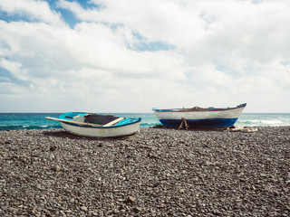 Two fisher boats at the beach
