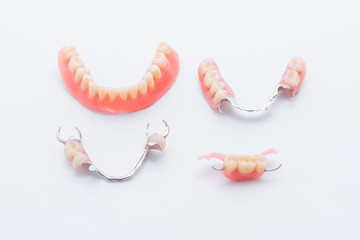 Set of dentures on white background