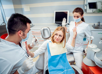 Obraz premium Young woman at the dental office