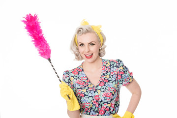 happy retro housewife, with feather duster, isolated on white