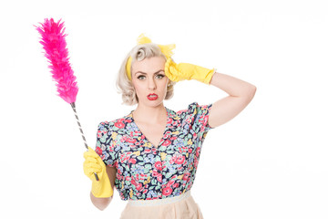 Stressed retro housewife, with feather duster, isolated on white