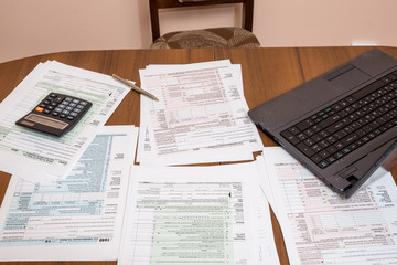 many 1040  US Individual Tax Form with laptop on table