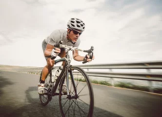 Foto op Canvas Cyclist pedaling on a racing bike outdoor © ramonespelt