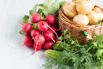 Fresh vegetables.   Early fresh vegetables on a light wooden background.