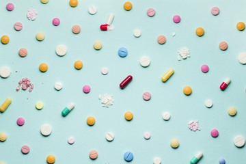 Pretty pills / A photo of different medicinal drugs, tablets and pills on blue background.