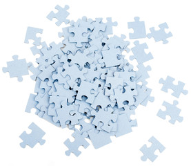 Pile of grey blank puzzle pieces 