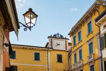 Fototapeta na wymiar The city clock of Peschiera del Garda, Italy