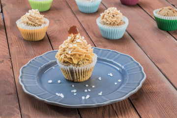 Muffin with Caramel and Sea Salt on a Gray Plate