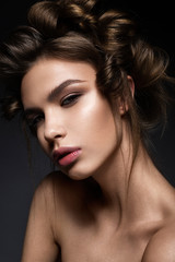 beautiful girl with a creative hairstyle and bright makeup. Beauty face