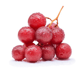 Red grapes and water drops isolated on white background