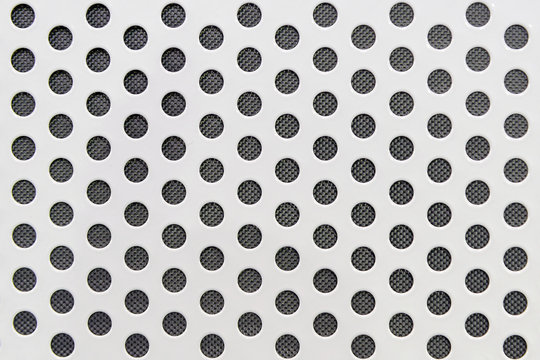 the white metal plate with the round holes,cabon fiber backgroun