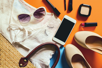 Flat lay photography with Smart phone and essential items for wo