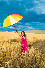 young woman in the field,  umbrella