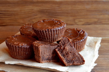 Fototapeta na wymiar Chocolate cupcakes. Sweet pastries. Delicious chocolate cupcakes. Baking recipe. Closeup