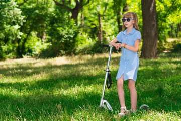 little girl on scooter